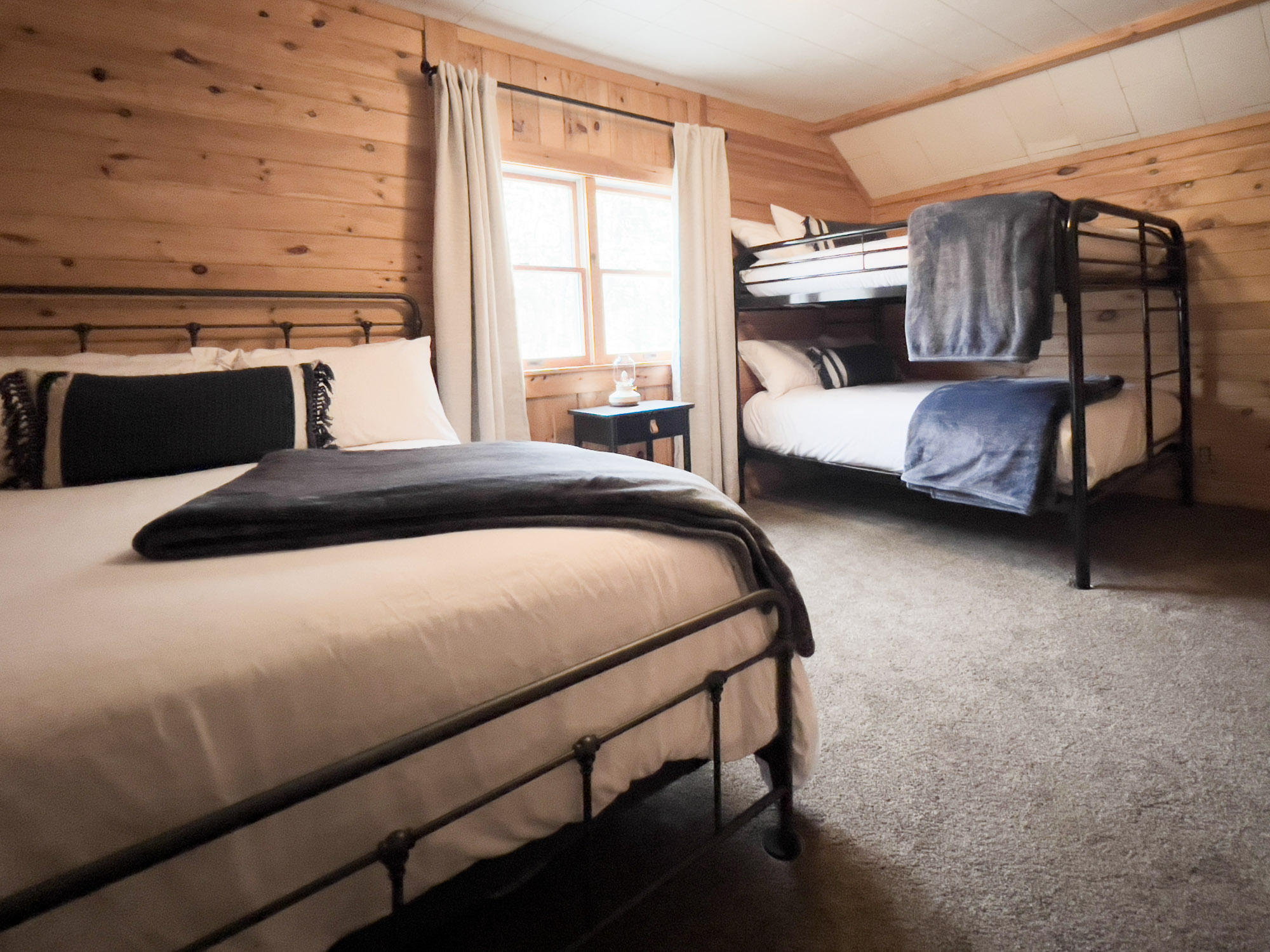 #4 Bunk room with Two Stacked Full Beds and a Queen Bed at Sleeping Bear Resort
